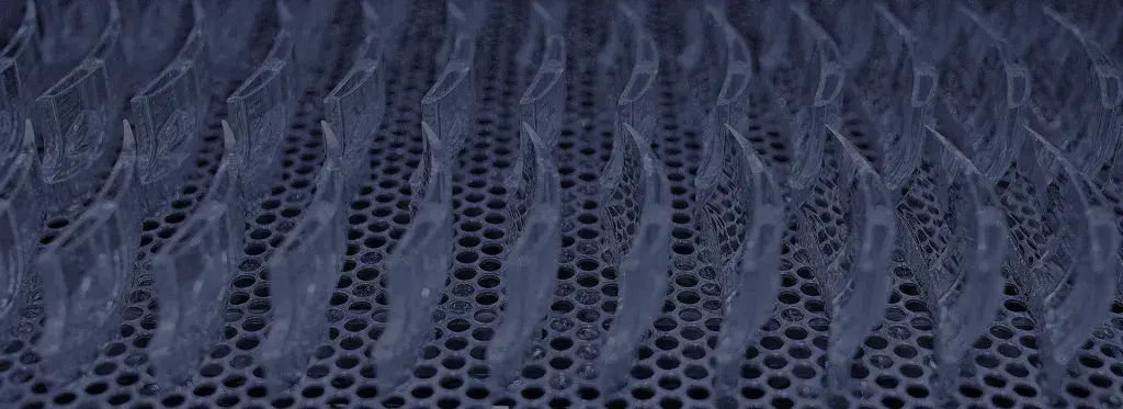 A close up of plastic parts made from an SLA 3D printer